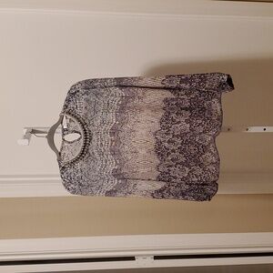 3. Tops- Jennifer Lopez blouse with rhinestone trim at neck.